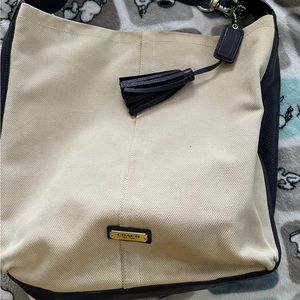 Coach purse, cream canvas with dark purple leather sides and strap.